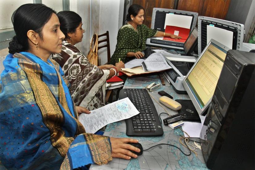 Women are seen working at a Union Digital Center. PHOTO