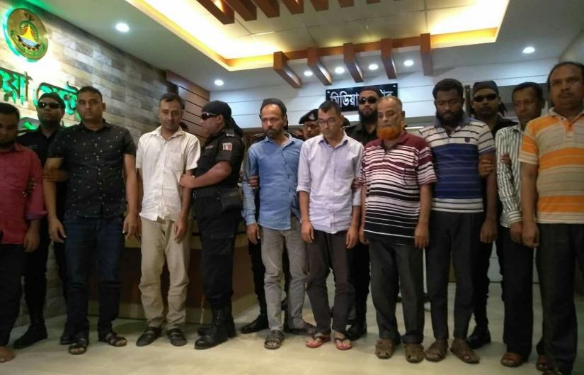 RAB produces the members of a fraud gang before media after detaining 16 active members the fraud ring from Dhaka on April 16, 2010.