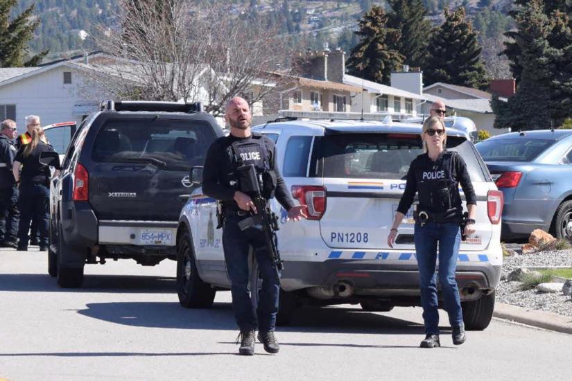 Royal Canadian Mounted Police (RCMP) officers attend a shooting scene on Cornwall Drive, during a series of attacks in which four people were shot dead, in Penticton, British Columbia, Canada April 15, 2019. REUTERS