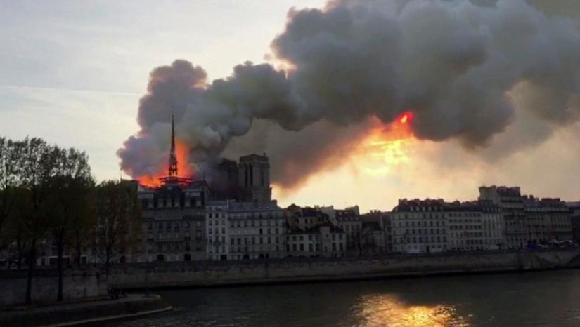 A still image taken from a video shows flames and thick smoke billowing from Notre Dame Cathedral in Paris, France April 15, 2019. REUTERS TV/via REUTERS