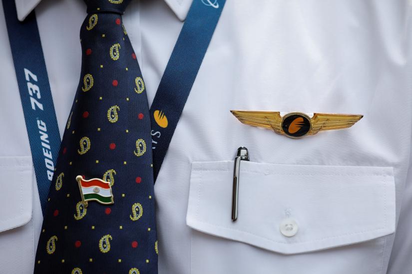 A Jet Airways button is seen pinned on a pilot`s shirt during a gathering outside the company`s headquarters in Mumbai, India, April 15, 2019. REUTERS