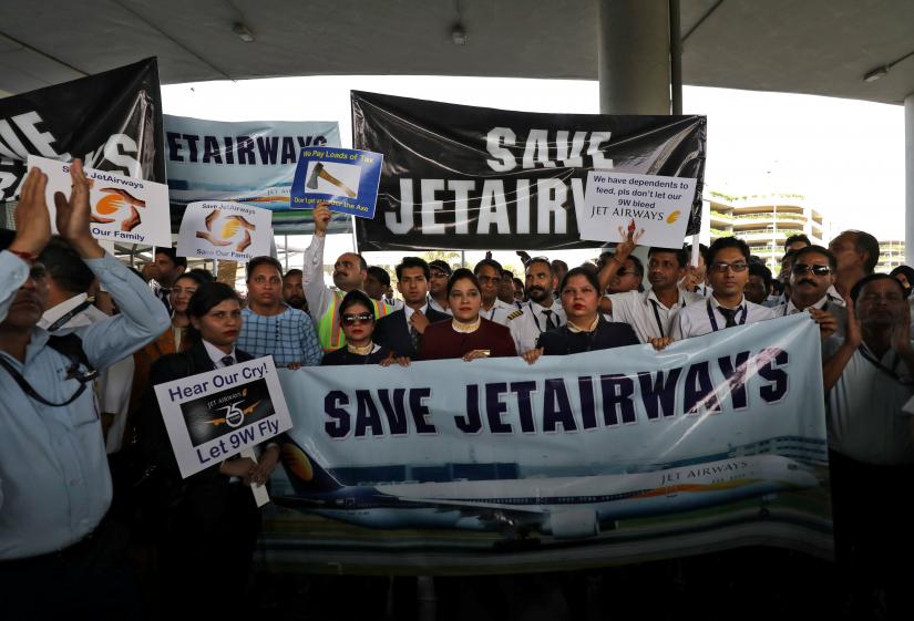 Jet Airways employees during a protest at the Indira Gandhi International Airport in New Delhi, India, April 13, 2019. REUTERS