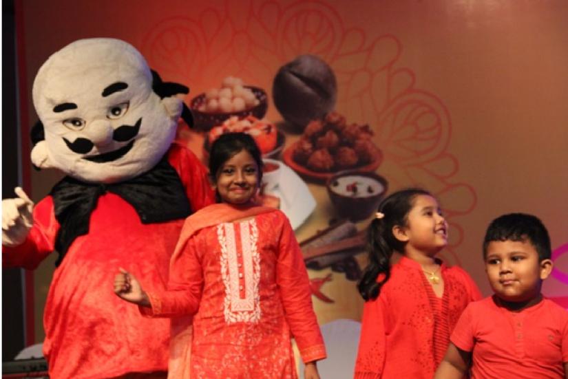 Children playing with cartoon mascots at Radisson Blu Dhaka`s `BornaliBoishakh` celebrations