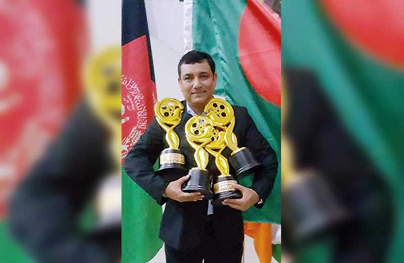 Tauquir Ahmed with awards of Haldaa