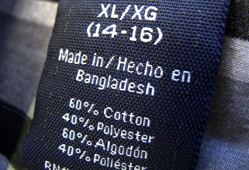 The clothing tag on a boy`s shirt which is made in Bangladesh is shown after purchase from a Walmart store in Encinitas, California, May 14, 2013. REUTERS/File Photo