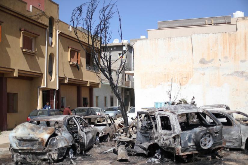 Damaged vehicles by an overnight shelling are seen in Abu Salim district in Tripoli, Libya April 17, 2019. REUTERS