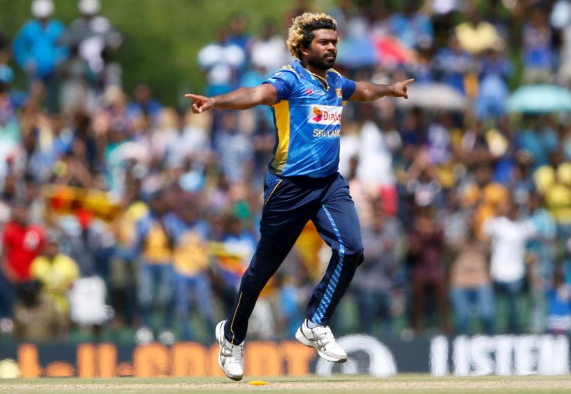 Sri Lanka`s Lasith Malinga celebrates after taking the wicket of England`s Liam Dawson (not pictured)