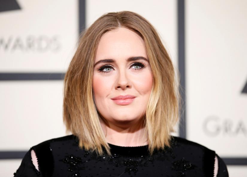 FILE PHOTO Singer Adele arrives at the 58th Grammy Awards in Los Angeles, California February 15, 2016