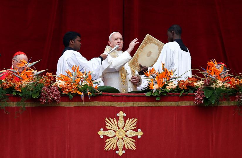 Pope Francis reads his `Urbi et Orbi` (`To the City and the World`) message from the balcony overlooking St. Peter`s Square at the Vatican April 21, 2019. REUTERS