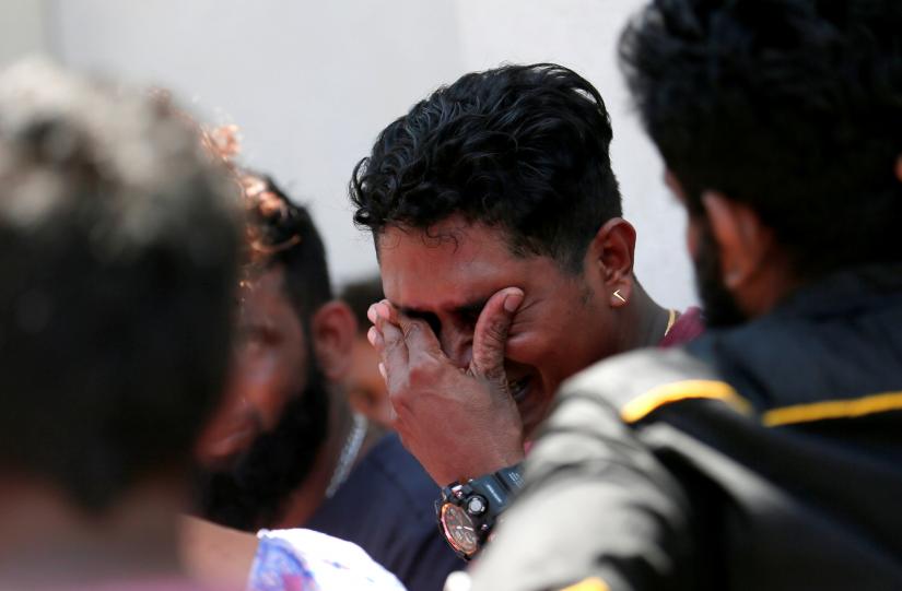 A relative of a victim of the explosion at St. Anthony's Shrine, Kochchikade church reacts at the police mortuary in Colombo