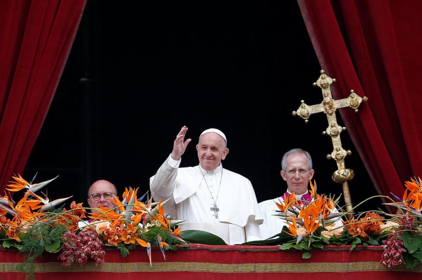 Pope Francis greets faithful after reading his `Urbi et Orbi` (`To the City and the World`) message from the balcony overlooking St. Peter`s Square at the Vatican April 21, 2019. REUTERS