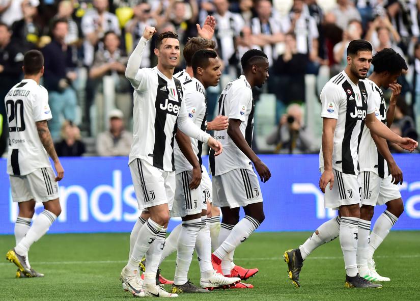 Juventus` Cristiano Ronaldo celebrates after Fiorentina`s Germsan Pezzella scores an own goal and Juventus` second.