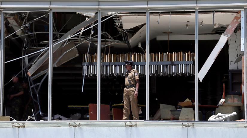 A police officer inspects the explosion area at Shangri-La hotel in Colombo, Sri Lanka April 21, 2019. REUTERS