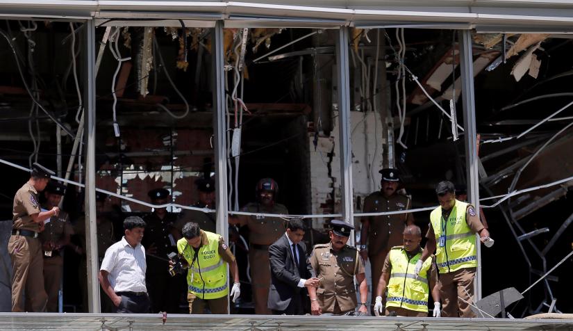 Crime scene officials inspect the explosion area at Shangri-La hotel in Colombo, Sri Lanka April 21, 2019. REUTERS