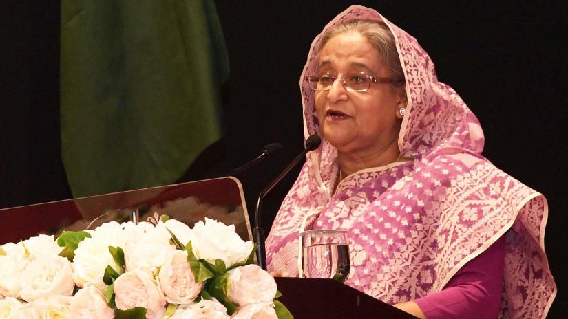 Prime Minister Sheikh Hasina addresses a mass reception accorded to her by Bangladesh community living in Brunei’s capital Brunei Darussalam at the Indera Samudera Ballroom of the Empire Hotel and County Club on Sunday (Apr 21). PID