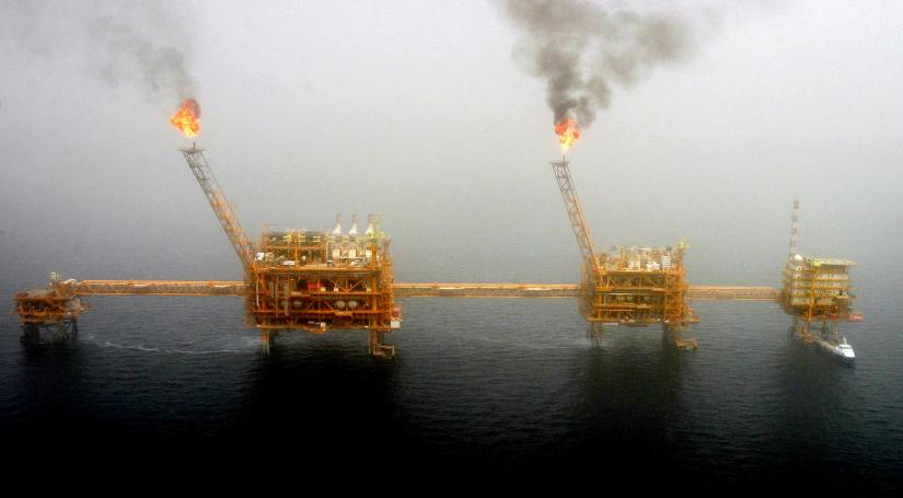 Gas flares from an oil production platform at the Soroush oil fields in the Persian Gulf, south of the capital Tehran, July 25, 2005. REUTERS-File Photo