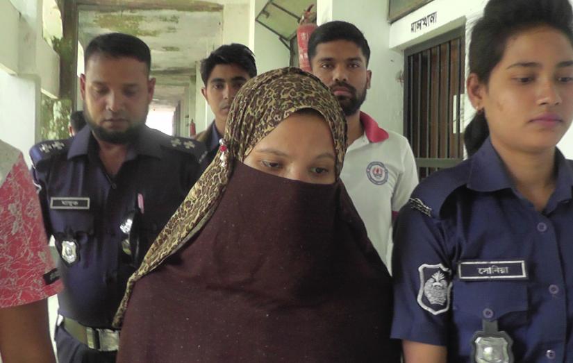 Police escort Kamrun Nahar Moni, a key suspect in the Nusrat Jahan Rafi murder case, at the Feni court premises on Monday (Apr 22).