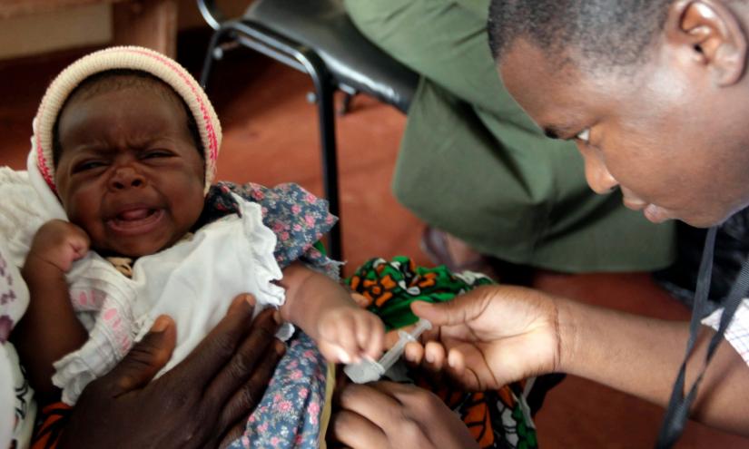 File photo shows a child being given an injection as part of a malaria vaccine trial at a clinic in Kenya. REUTERS