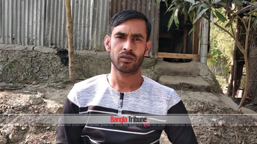 This February 2019 shows Jahalam sitting in front of his house in Tangail’s Nagarpur upazila. FILE PHOTO