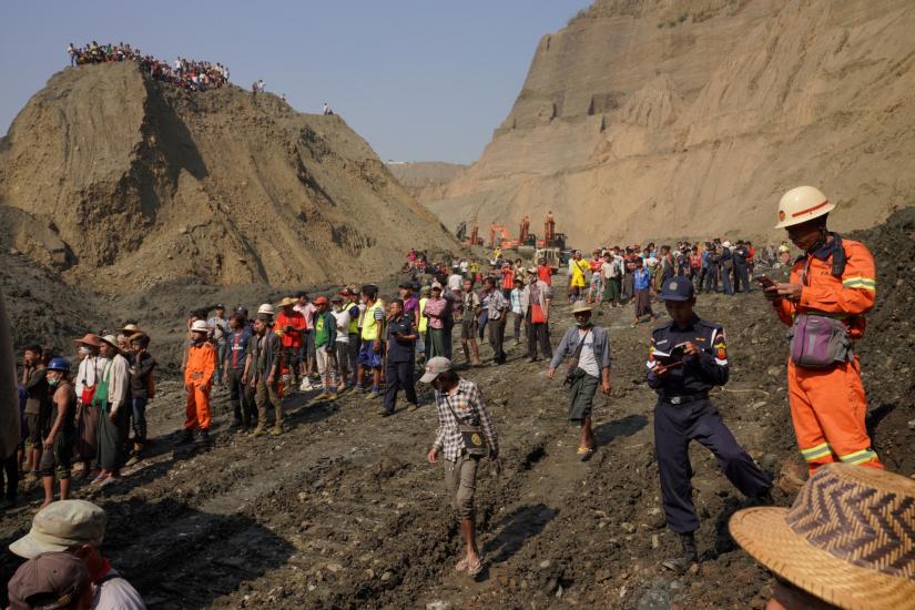 Local people look on in a jade mine where the mud dam collapsed in Hpakant, Kachin state, Myanmar April 23, 2019. REUTERS
