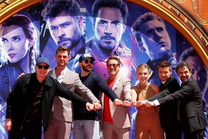 ctors Robert Downey Jr., Chris Evans, Mark Ruffalo, Chris Hemsworth, Scarlett Johansson, Jeremy Renner and Marvel Studios President Kevin Feige pose for a photo at the handprint ceremony at the TCL Chinese Theatre in Hollywood, Los Angeles, California, U.S. April 23, 2019. REUTERS