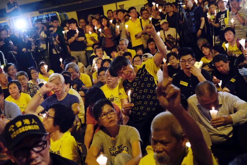 Pro-democracy supporters attend candlelight vigils to support four jailed leaders of the 2014 pro-democracy `Occupy` movement, also known as `Umbrella Movement`, outside Lai Chi Kok Reception Centre in Hong Kong, China April 24, 2019. REUTERS