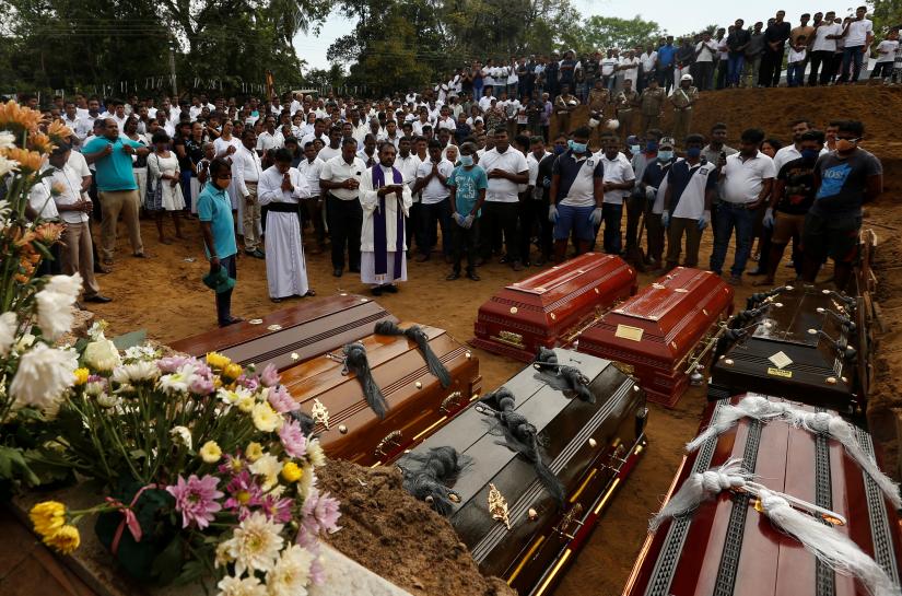People participate in a mass funeral in Negombo, three days after a string of suicide bomb attacks on churches and luxury hotels across the island on Easter Sunday, in Sri Lanka April 24, 2019. REUTERS