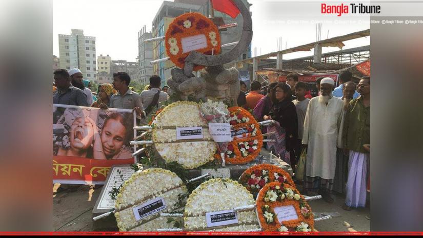Families of victims placing wreaths on a temporary altar erected in memory of the Rana Plaza collapse, on Wednesday (Apr 24, 2019).