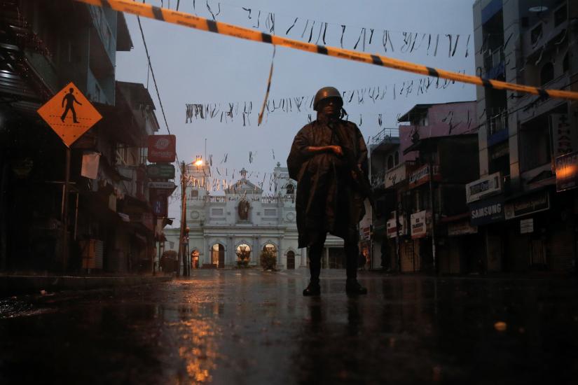 A soldier stands guard at St. Anthony`s Shrine during heavy rain, days after a string of suicide bomb attacks on churches and luxury hotels across the island on Easter Sunday, in Colombo, Sri Lanka April 25, 2019. REUTERS
