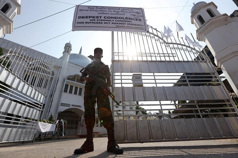 A member of the Civil Defence Force keeps watch outside Negombo Grand Mosque, following a string of suicide attacks on churches and luxury hotels, in Negombo, Sri Lanka, April 25, 2019. REUTERS