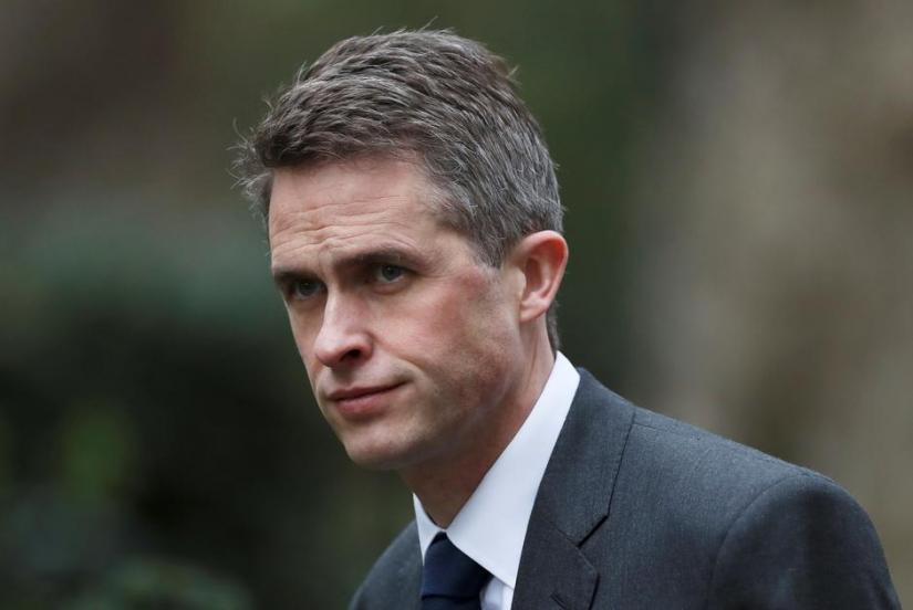 Britain`s Defence Minister Gavin Wiliamson is seen outside Downing Street in London, Britain, March 12, 2019. REUTERS
