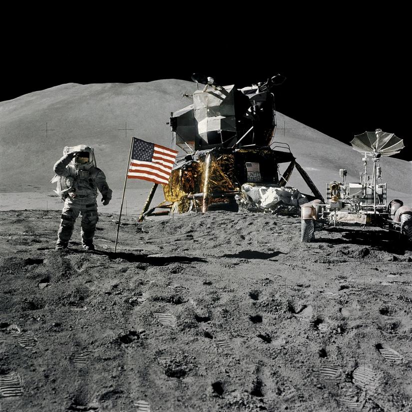 FILE PHOTO: Astronaut James Irwin, lunar module pilot, gives a military salute while standing beside the U.S. flag during Apollo 15 lunar surface extravehicular activity (EVA) at the Hadley-Apennine landing site on the moon, August 1, 1971. NASA/David Scott/Handout via REUTERS