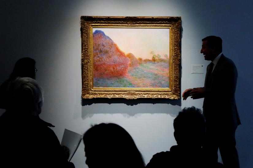 The painting by Claude Monet, part of the Haystacks 'Les Meules' series is displayed at Sotheby's during a press preview of their upcoming impressionist and modern art sale in New York, US, May 3, 2019. REUTERS