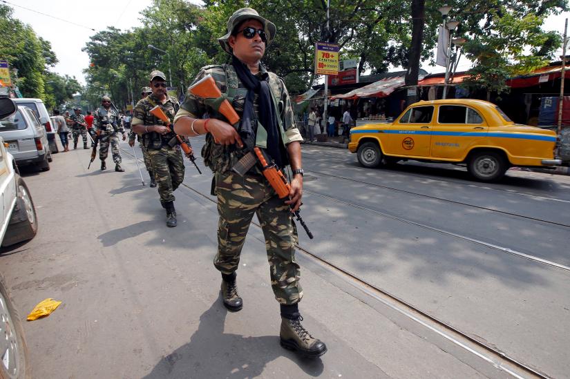 Central Reserve Police Force (CRPF) personnel conduct route march in a street ahead of the seventh and last phase of general election, in Kolkata, India, May 15, 2019. REUTERS