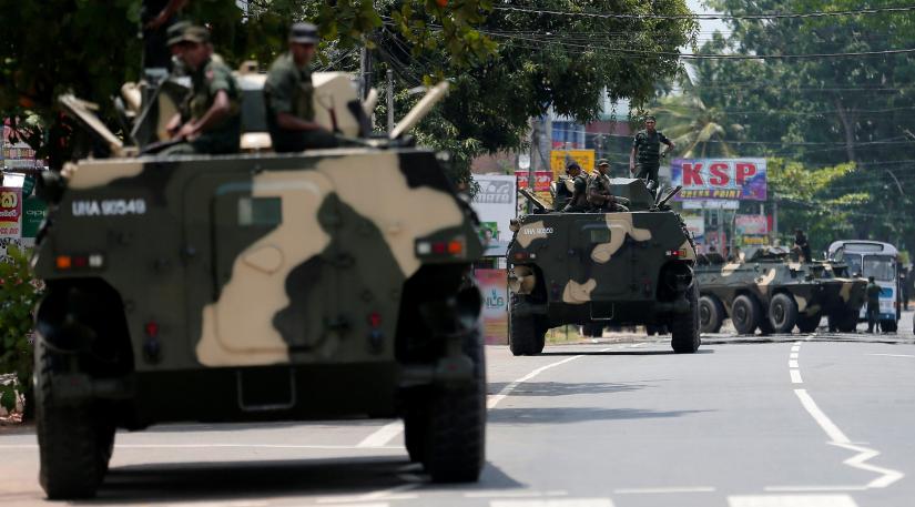 Sri Lankan soldiers patrol a road of Hettipola on top of an armored vehicle, after a mob attack in a mosque in the nearby village of Kottampitiya, Sri Lanka May 14, 2019. REUTERS