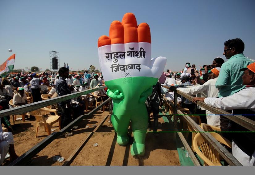 A supporter wearing an inflatable symbol of India`s main opposition Congress party walks during a public meeting in Gandhinagar, Gujarat, India, March 12, 2019. The words read: `Long live Rahul Gandhi`. REUTERS/File Photo