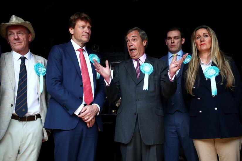 Brexit Party leader Nigel Farage and members of the party attend a Brexit Party campaign event in Essex, Britain, May 16, 2019. REUTERS