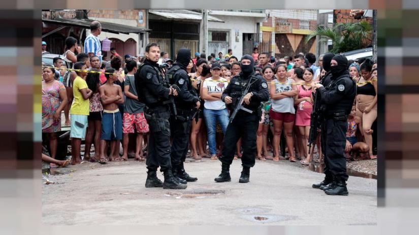 Policemen are seen at a site where, according to local media, an armed group entered and opened fire at a bar, killing and wounding its patrons, in Belem, Para state, Brazil May 19, 2019. REUTERS