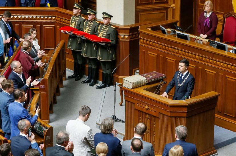 Ukraine`s President-elect Volodymyr Zelenskiy speaks as he takes the oath of office during his inauguration ceremony in the parliament hall in Kiev, Ukraine May 20, 2019. REUTERS