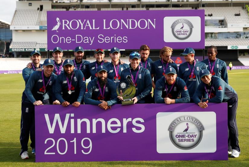England players pose as they celebrate winning the match with the trophy at Emerald Headingley, Headingley, Britain on May 19, 2019. Reuters
