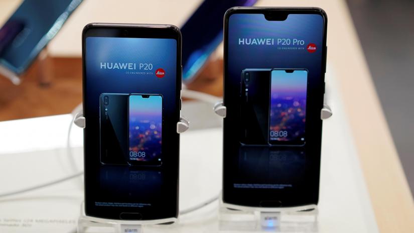 Mobile phones are seen at Huawei store in Madrid, Spain February 7, 2019. REUTERS