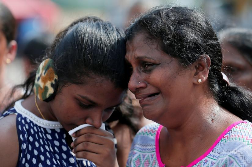 Devotees cry while praying in front of St Anthony`s church, one of the churches attacked in the April 21st Easter Sunday Islamic militant bombings, during the first month remembrance service, in Colombo, Sri Lanka May 21, 2019. REUTERS