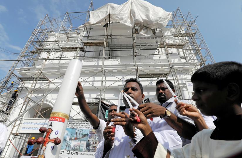 A priest blesses outside St Anthony`s church, one of the churches attacked in the April 21st Easter Sunday Islamic militant bombings, during the first-month remembrance service, in Colombo, Sri Lanka May 21, 2019. REUTERS