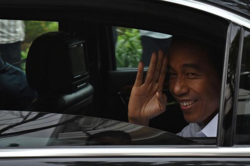 Incumbent Indonesian president Joko Widodo leaves after a press briefing in Jakarta, Indonesia, April 18, 2019. Antara Foto/ via REUTERS