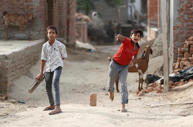 Muslim children play cricket in village Nayabans in the northern state of Uttar Pradesh, India May 10, 2019. Picture taken on May 10, 2019. REUTERS