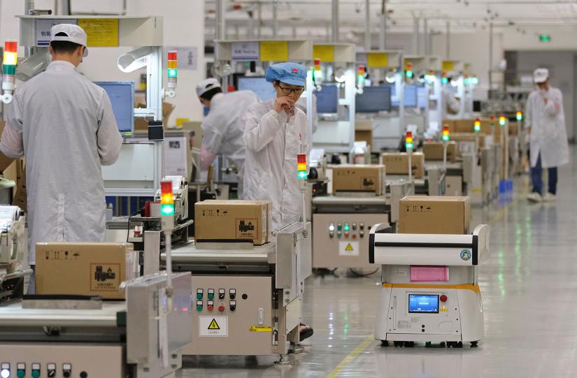 Employees work on a mobile phone production line at Huawei’s factory campus in the southern Chinese city of Dongguan. Huawei has eclipsed telecom equipment giants Ericsson and Nokia in terms of market share. REUTERS