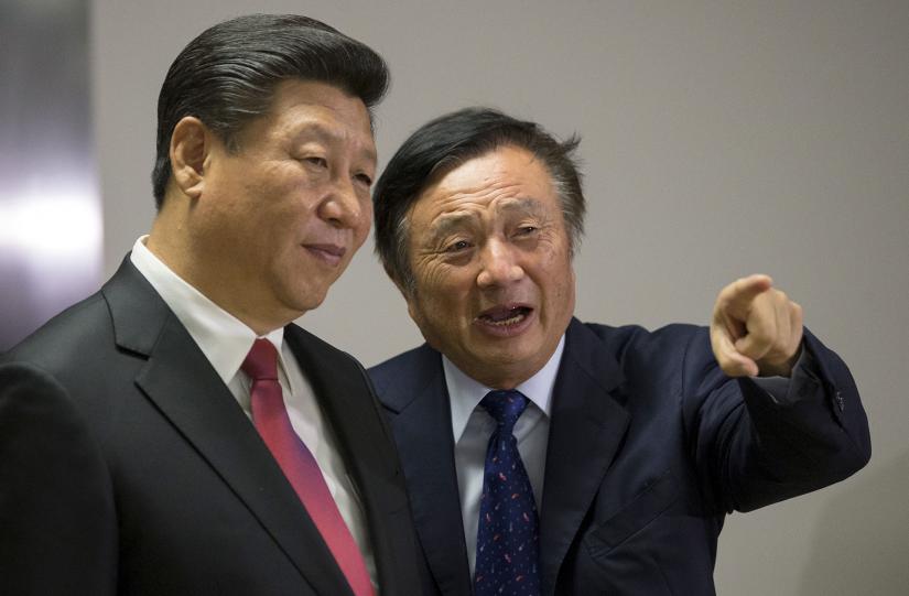 Chinese President Xi Jinping (left) is shown around the offices of Huawei in London by company founder Ren Zhengfei in 2015. Ren has rejected allegations that Huawei would engage in espionage on behalf of the Chinese government. REUTERS