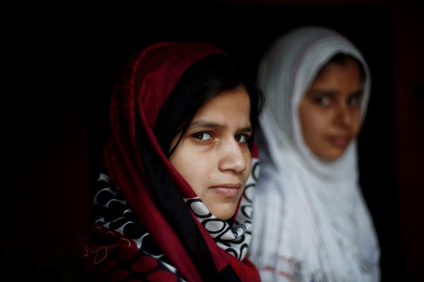 Aisha, a law student, stands inside her house house in village Nayabans in the northern state of Uttar Pradesh, India May 10, 2019. Picture taken on May 10, 2019. REUTERS