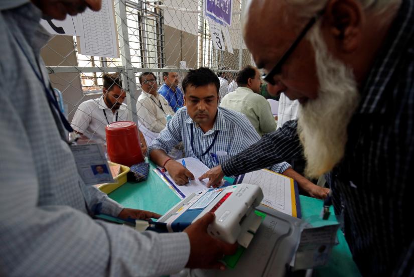 Election staff members count votes inside a vote counting centre in Ahmedabad, India, May 23, 2019. REUTERS