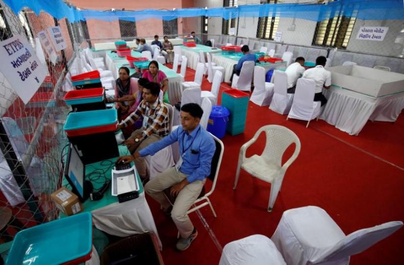 Election staff members work on their computers in a vote counting centre in Ahmedabad, India, May 22, 2019. REUTERS
